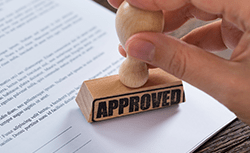 approved stamp and paper